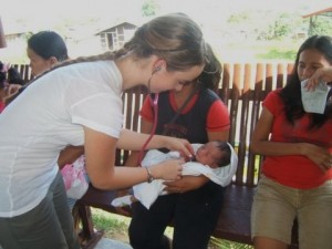 Midwife checking a baby's heart