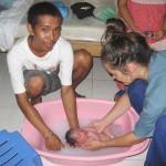 Father Bathing Baby