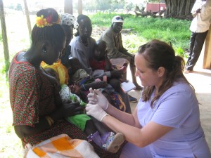 Stephanie Williams attending to young child